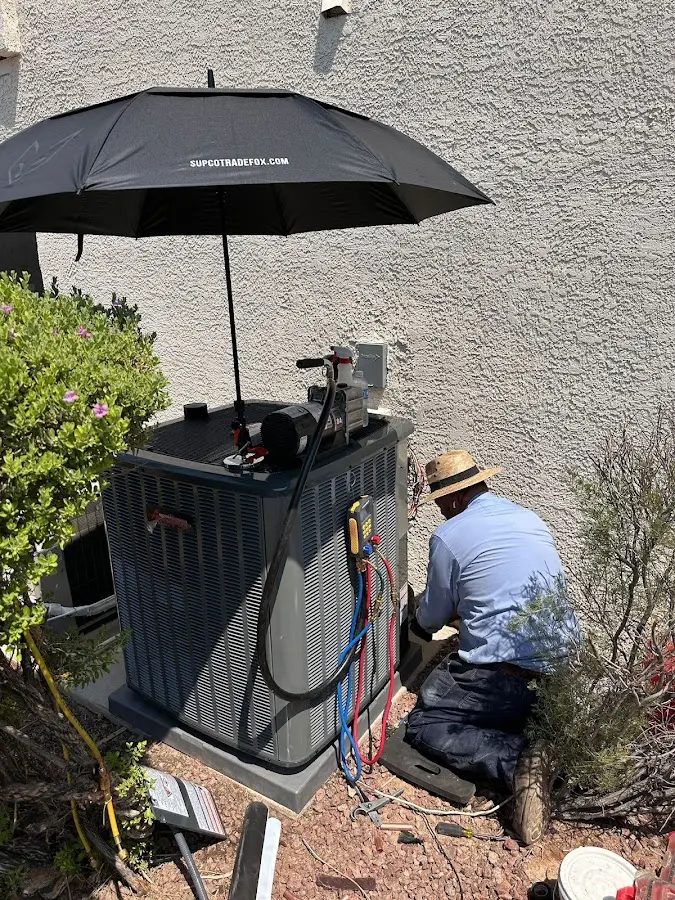 HVAC technician performing outdoor AC maintenance in Norway